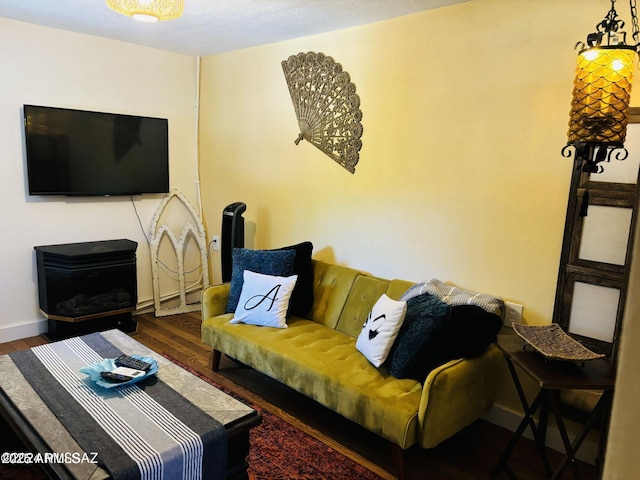 living room featuring wood finished floors and baseboards