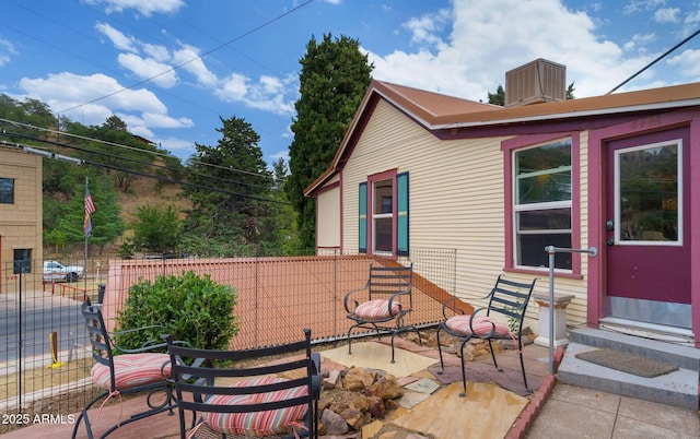 view of patio / terrace featuring entry steps and fence