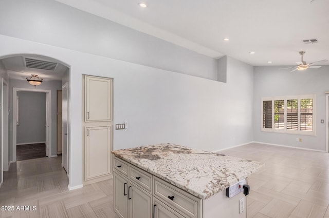 1712 E Saratoga St, Gilbert, AZ 85296 - kitchen featuring open floor plan, a ceiling fan, visible vents, and arched walkways