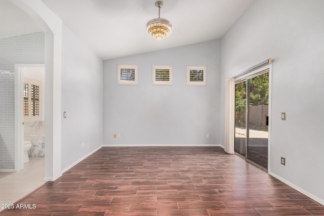1712 E Saratoga St, Gilbert, AZ 85296 - unfurnished room with lofted ceiling, baseboards, arched walkways, and dark wood-type flooring