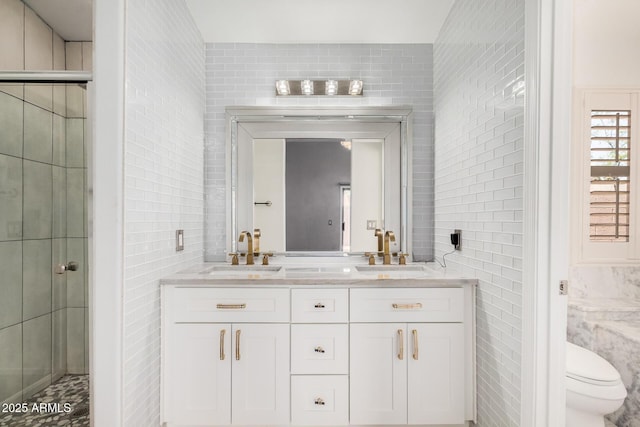1712 E Saratoga St, Gilbert, AZ 85296 - bathroom featuring toilet, a sink, and tile walls