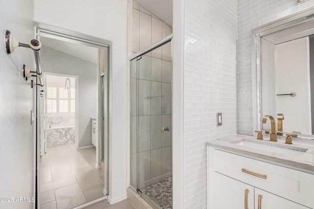 1712 E Saratoga St, Gilbert, AZ 85296 - bathroom featuring tile walls, vanity, and a stall shower