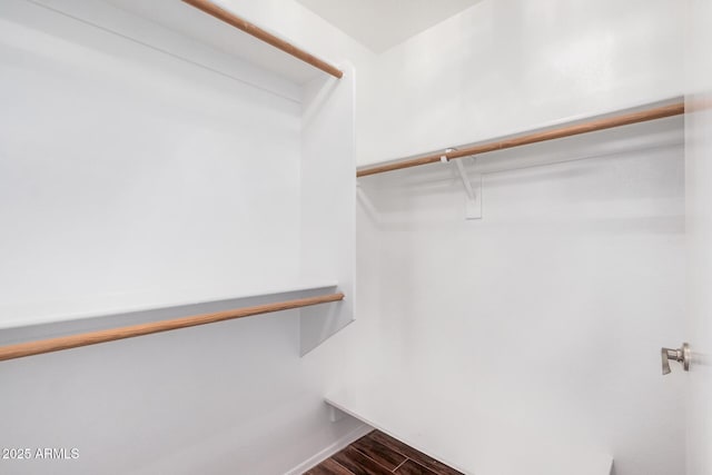 1712 E Saratoga St, Gilbert, AZ 85296 - spacious closet featuring dark wood-style floors