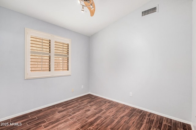1712 E Saratoga St, Gilbert, AZ 85296 - unfurnished room with dark wood-style floors, baseboards, and visible vents