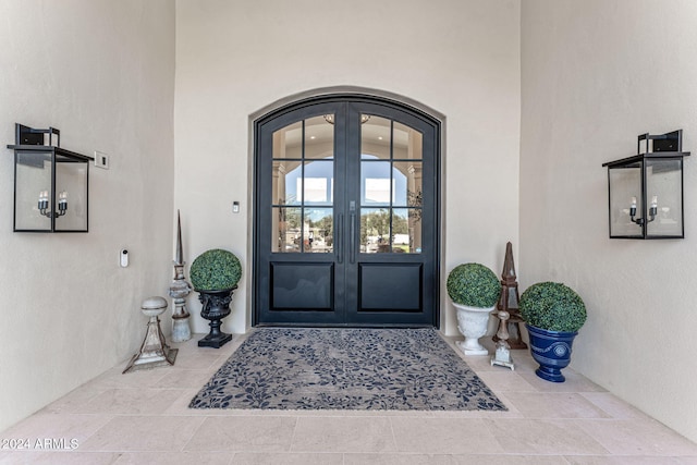 property entrance featuring french doors