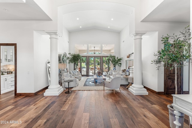 interior space featuring dark hardwood / wood-style flooring, high vaulted ceiling, and french doors