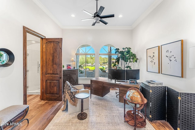 office area featuring light hardwood / wood-style floors, ceiling fan, and ornamental molding