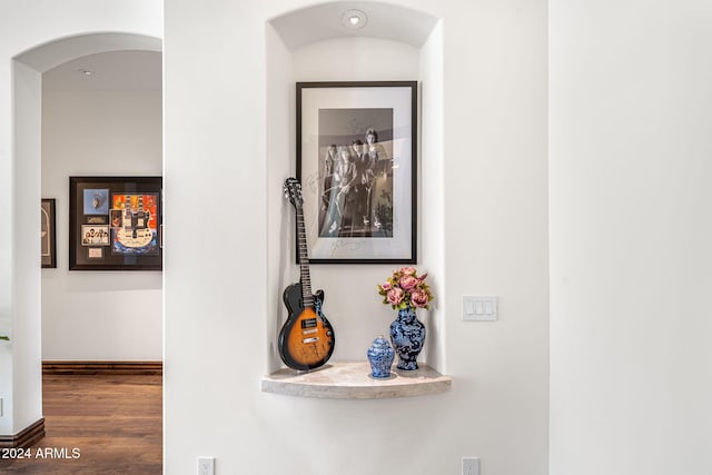 hall with dark hardwood / wood-style floors