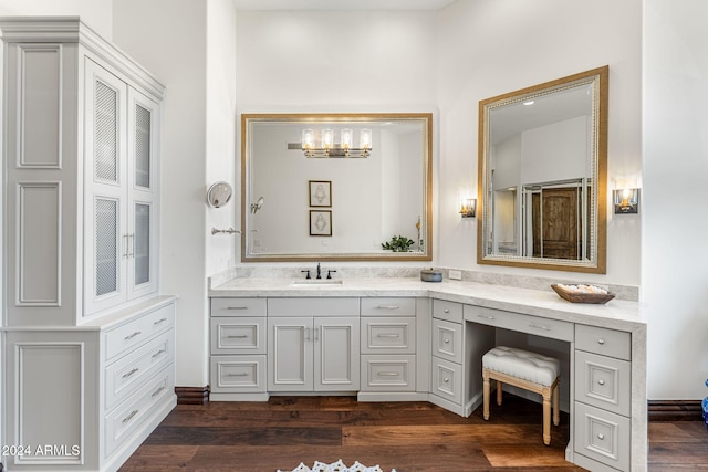 bathroom featuring hardwood / wood-style floors and vanity