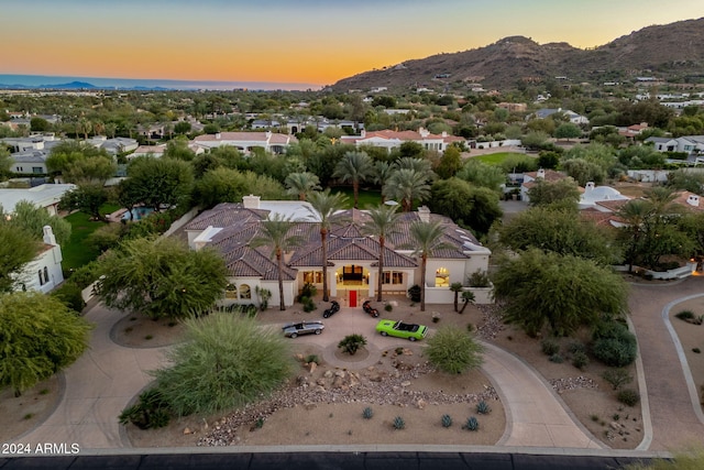 aerial view at dusk with a mountain view