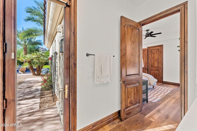 bathroom with wood-type flooring and ceiling fan