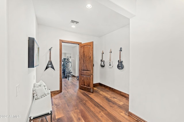 corridor featuring dark wood-type flooring