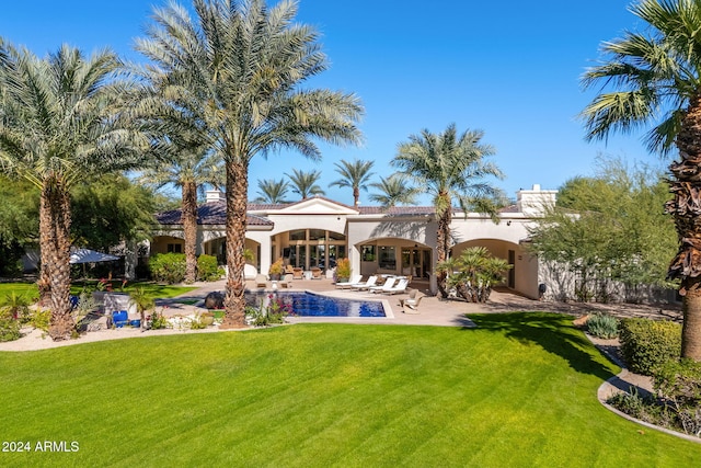 exterior space with a patio area and a lawn