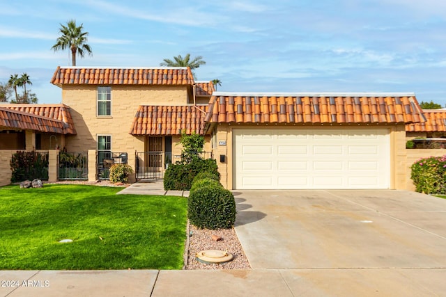 view of front facade featuring an attached garage, fence, a tile roof, driveway, and a front yard