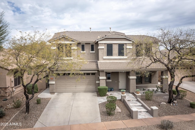 35317 N 31st Dr, Phoenix, AZ 85086 - view of front of house featuring concrete driveway, stucco siding, a garage, a tiled roof, and a porch