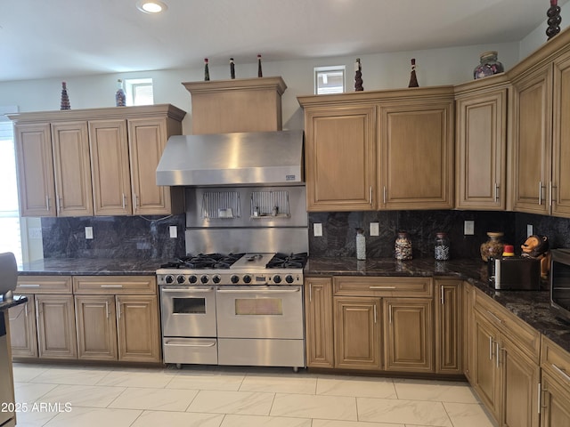 35317 N 31st Dr, Phoenix, AZ 85086 - kitchen with recessed lighting, dark stone countertops, range with two ovens, extractor fan, and backsplash