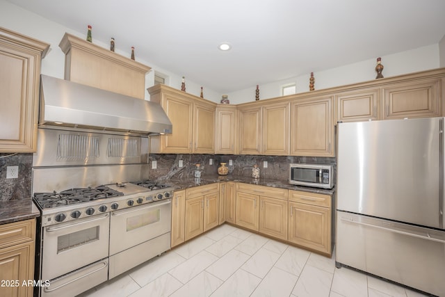 35317 N 31st Dr, Phoenix, AZ 85086 - kitchen with wall chimney range hood, stainless steel appliances, dark stone countertops, and tasteful backsplash