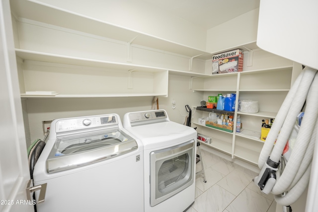 35317 N 31st Dr, Phoenix, AZ 85086 - clothes washing area featuring washing machine and clothes dryer, marble finish floor, and laundry area