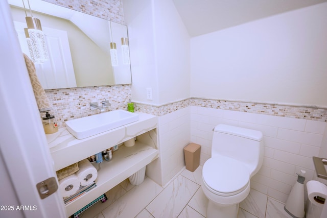 35317 N 31st Dr, Phoenix, AZ 85086 - bathroom featuring toilet, a wainscoted wall, and tile walls