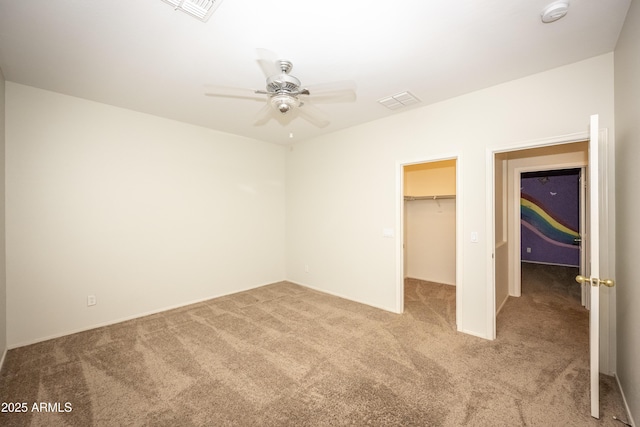 35317 N 31st Dr, Phoenix, AZ 85086 - unfurnished bedroom featuring light colored carpet, visible vents, and a walk in closet