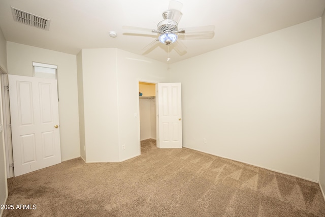 35317 N 31st Dr, Phoenix, AZ 85086 - unfurnished bedroom featuring carpet flooring, a spacious closet, visible vents, a ceiling fan, and a closet