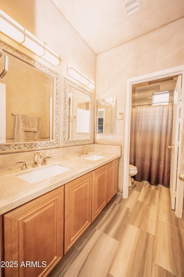35317 N 31st Dr, Phoenix, AZ 85086 - full bathroom featuring visible vents, a sink, toilet, and double vanity