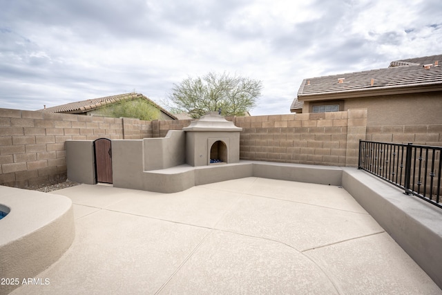 35317 N 31st Dr, Phoenix, AZ 85086 - view of patio / terrace with a fenced backyard and a fireplace