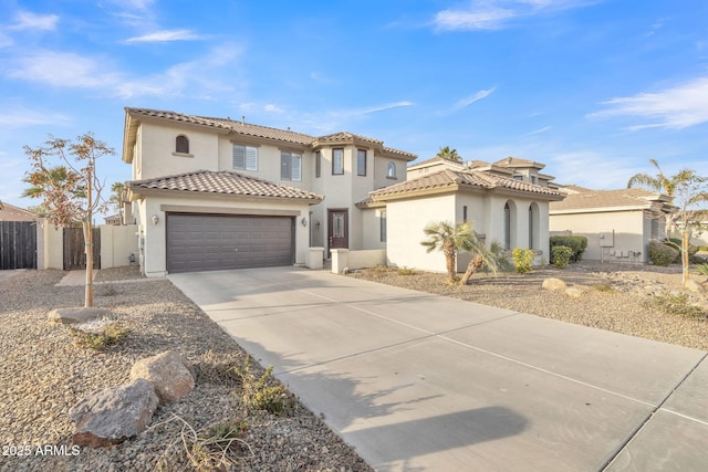 mediterranean / spanish-style home with a garage