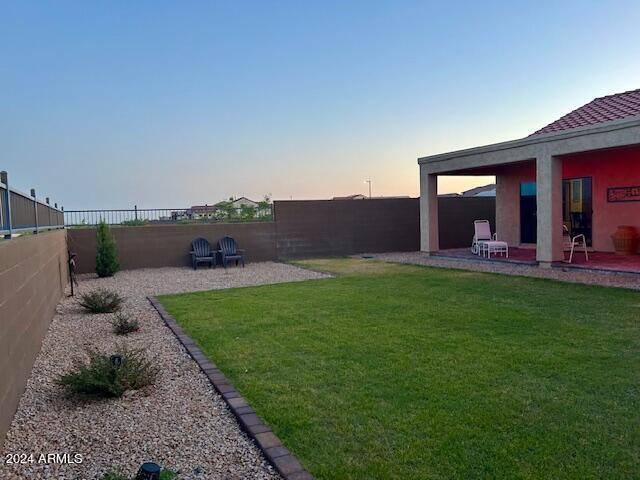 2525 N Riverside Dr, Florence, AZ 85132 - yard at dusk featuring a patio