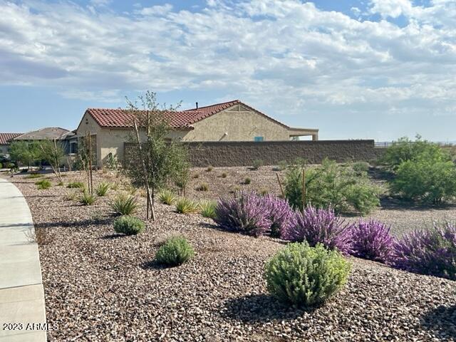 2525 N Riverside Dr, Florence, AZ 85132 - view of side of property with fence, stucco siding, and a tiled roof