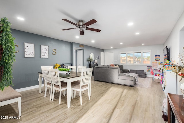 dining space featuring ceiling fan and light hardwood / wood-style floors