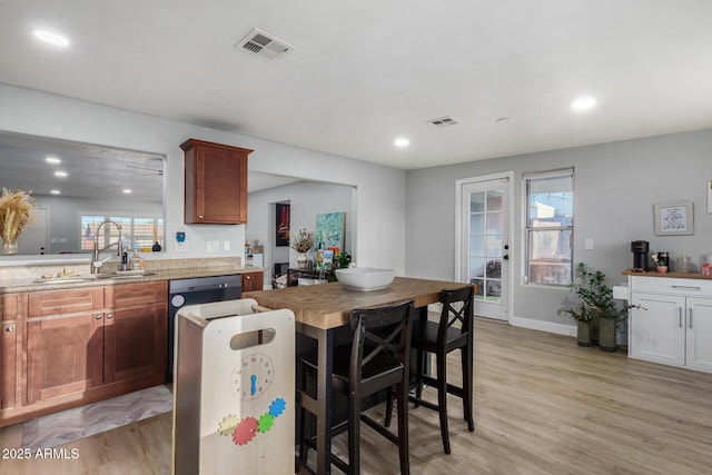 kitchen featuring sink and light hardwood / wood-style flooring