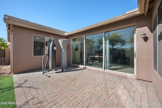 view of patio / terrace featuring fence