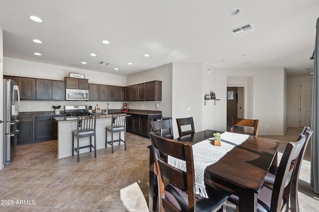 dining space featuring recessed lighting and visible vents
