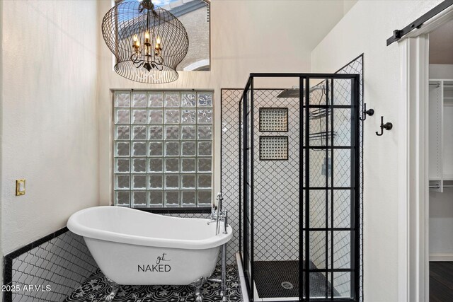 26264 N 46th St, Phoenix, AZ 85050 - bathroom with a stall shower, a chandelier, a freestanding tub, baseboards, and tile patterned floors