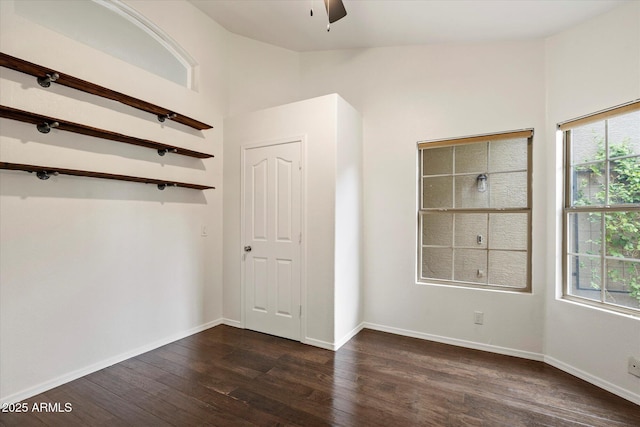26264 N 46th St, Phoenix, AZ 85050 - unfurnished bedroom featuring dark wood finished floors, baseboards, vaulted ceiling, and ceiling fan