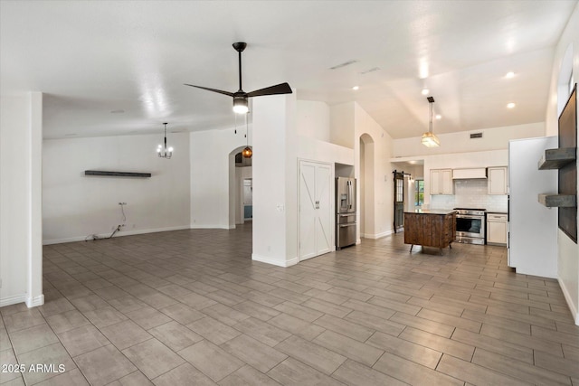 26264 N 46th St, Phoenix, AZ 85050 - kitchen featuring open floor plan, arched walkways, appliances with stainless steel finishes, ceiling fan, and high vaulted ceiling