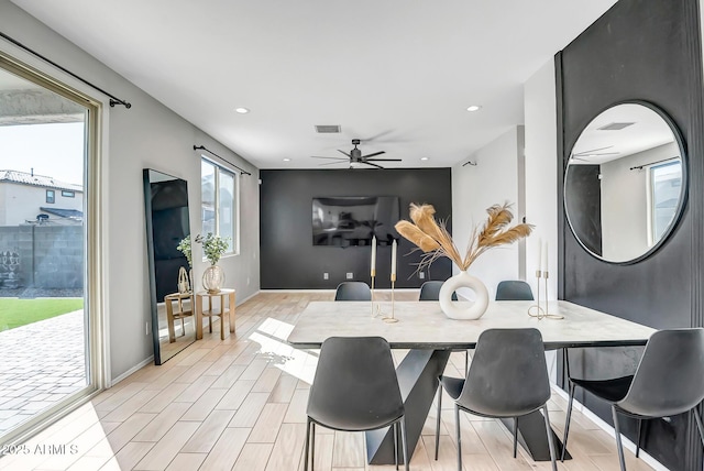 dining room with wood tiled floor, visible vents, a ceiling fan, and recessed lighting