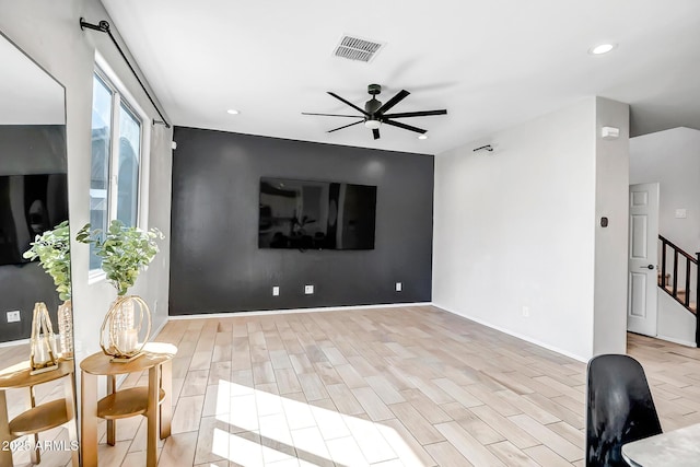 living area featuring recessed lighting, light wood-type flooring, visible vents, and a ceiling fan