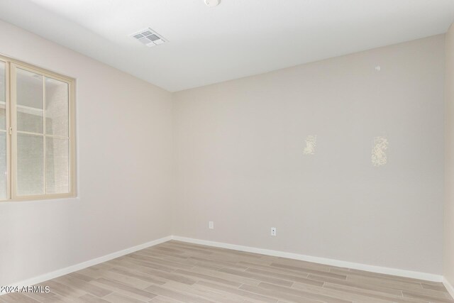 unfurnished room featuring light hardwood / wood-style flooring