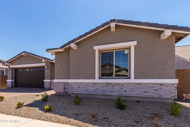 view of side of property featuring a garage