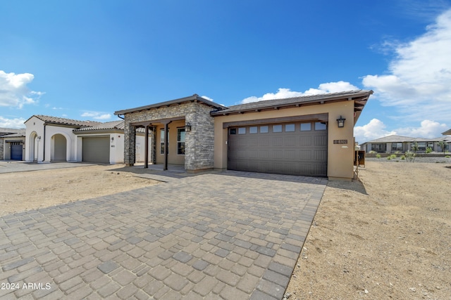 view of front of property with a garage