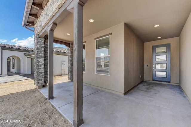 property entrance with a patio area