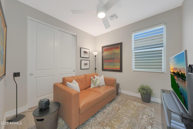 18746 W Rancho Dr, Litchfield Park, AZ 85340 - living area with visible vents, ceiling fan, light wood-style floors, and baseboards