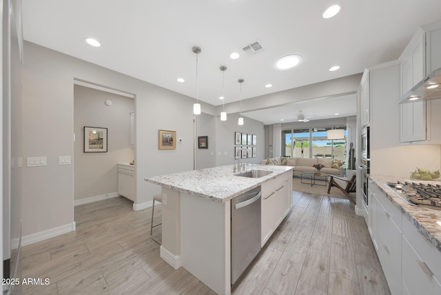 18746 W Rancho Dr, Litchfield Park, AZ 85340 - kitchen with a sink, open floor plan, visible vents, appliances with stainless steel finishes, and an island with sink