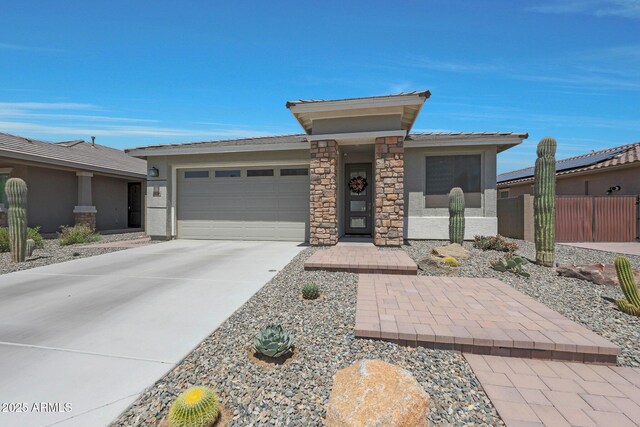 18746 W Rancho Dr, Litchfield Park, AZ 85340 - prairie-style house featuring fence, concrete driveway, stucco siding, and a garage
