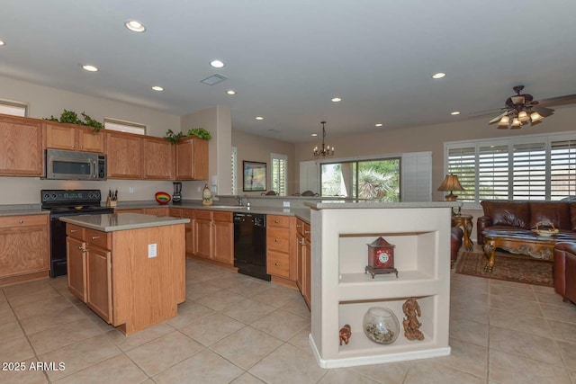 kitchen featuring light tile patterned flooring, decorative light fixtures, a center island, kitchen peninsula, and black appliances