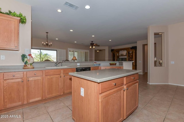 kitchen featuring light tile patterned flooring, black dishwasher, kitchen peninsula, a kitchen island, and ceiling fan with notable chandelier