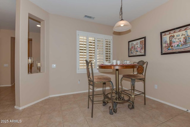 dining room featuring light tile patterned flooring