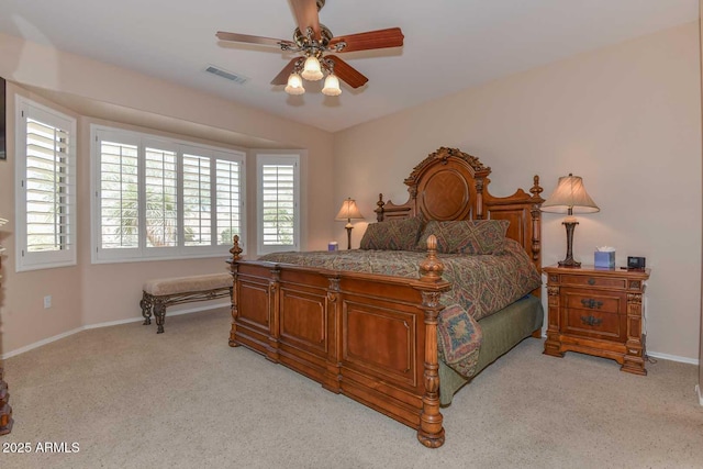 bedroom with ceiling fan and light colored carpet